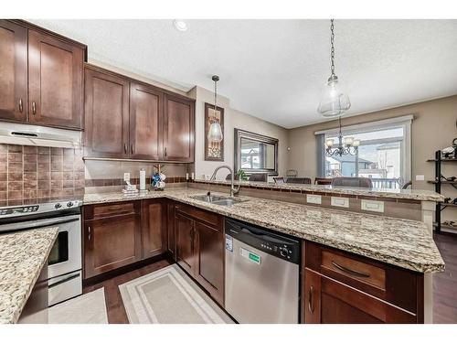1589 Copperfield Boulevard Se, Calgary, AB - Indoor Photo Showing Kitchen With Double Sink