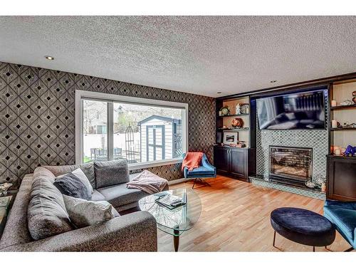 163 Scenic Glen Place Nw, Calgary, AB - Indoor Photo Showing Living Room With Fireplace