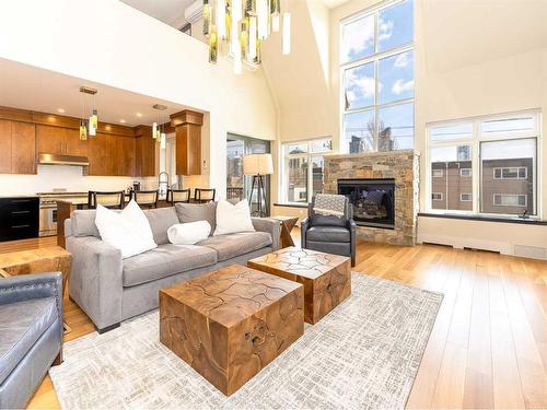 303-1407 Kensington Close Nw, Calgary, AB - Indoor Photo Showing Living Room With Fireplace