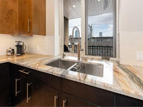 303-1407 Kensington Close Nw, Calgary, AB - Indoor Photo Showing Kitchen With Double Sink