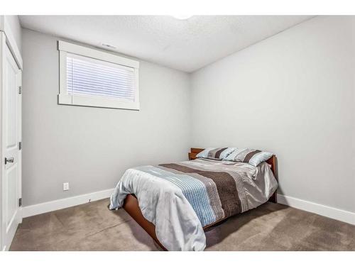 137 Rockcliff Bay Nw, Calgary, AB - Indoor Photo Showing Bedroom
