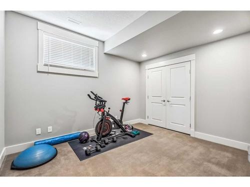 137 Rockcliff Bay Nw, Calgary, AB - Indoor Photo Showing Gym Room