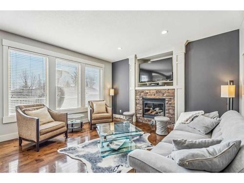 137 Rockcliff Bay Nw, Calgary, AB - Indoor Photo Showing Living Room With Fireplace