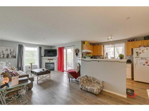 219-3000 Citadel Meadow Point Nw, Calgary, AB - Indoor With Fireplace