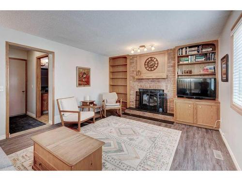 171 Riverbrook Way Se, Calgary, AB - Indoor Photo Showing Living Room With Fireplace