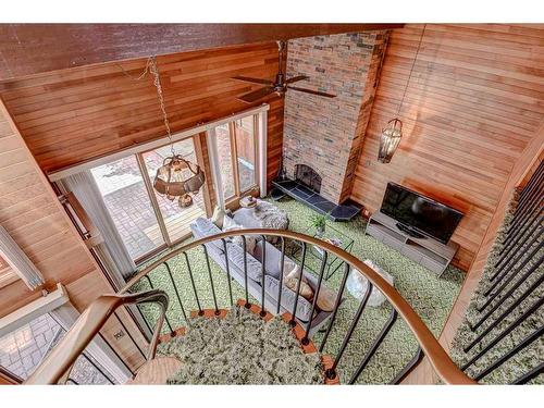 4520 Charleswood Drive Nw, Calgary, AB - Indoor Photo Showing Other Room With Fireplace