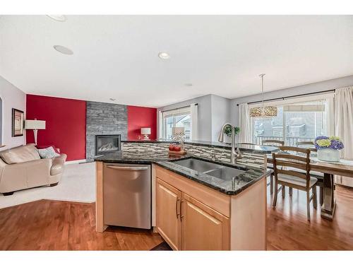 129 Royal Oak Bay Nw, Calgary, AB - Indoor Photo Showing Kitchen With Fireplace With Double Sink