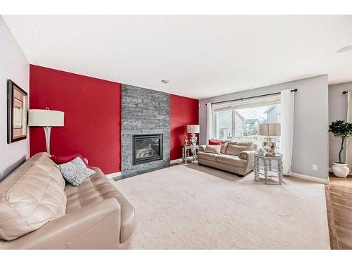 129 Royal Oak Bay Nw, Calgary, AB - Indoor Photo Showing Living Room With Fireplace