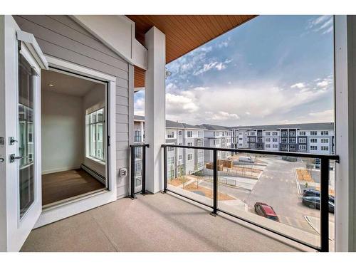 1411-681 Savanna Boulevard Ne, Calgary, AB - Outdoor With Balcony With Exterior