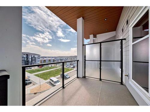 1411-681 Savanna Boulevard Ne, Calgary, AB - Outdoor With Balcony With Exterior