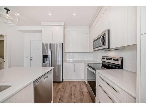 1411-681 Savanna Boulevard Ne, Calgary, AB - Indoor Photo Showing Kitchen With Stainless Steel Kitchen With Upgraded Kitchen
