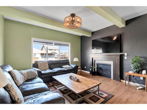 12 Legacy Bay Se, Calgary, AB - Indoor Photo Showing Living Room With Fireplace