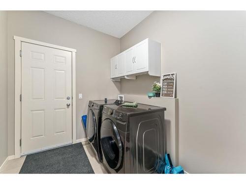 40 Sunrise View, Cochrane, AB - Indoor Photo Showing Laundry Room