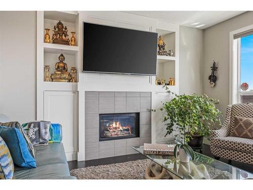243 Aspen Acres Manor Sw, Calgary, AB - Indoor Photo Showing Living Room With Fireplace