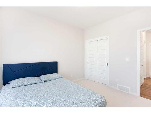 657 Windrow Manor Sw, Airdrie, AB - Indoor Photo Showing Bedroom