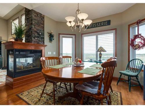 16 Hillcrest Boulevard, Strathmore, AB - Indoor Photo Showing Dining Room With Fireplace