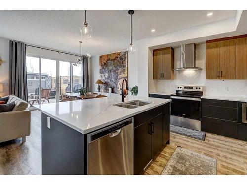 11 Arbour Lake Heights Nw, Calgary, AB - Indoor Photo Showing Kitchen With Double Sink With Upgraded Kitchen
