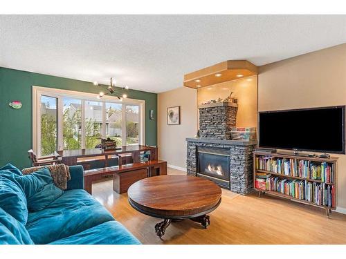 5843 22 Avenue Ne, Calgary, AB - Indoor Photo Showing Living Room With Fireplace