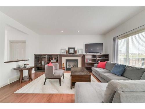 144 Cranford Drive Se, Calgary, AB - Indoor Photo Showing Living Room With Fireplace