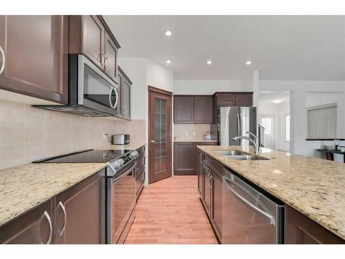 144 Cranford Drive Se, Calgary, AB - Indoor Photo Showing Kitchen With Double Sink With Upgraded Kitchen