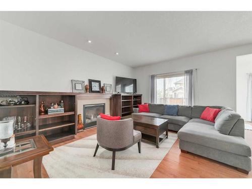 144 Cranford Drive Se, Calgary, AB - Indoor Photo Showing Living Room With Fireplace