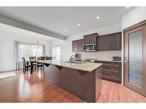 144 Cranford Drive Se, Calgary, AB - Indoor Photo Showing Kitchen With Double Sink With Upgraded Kitchen