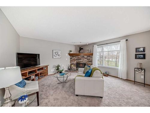 250 Somerside Green Sw, Calgary, AB - Indoor Photo Showing Living Room With Fireplace