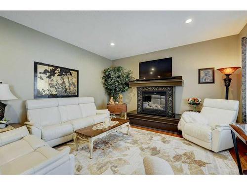 817 Beckner Crescent, Carstairs, AB - Indoor Photo Showing Living Room With Fireplace