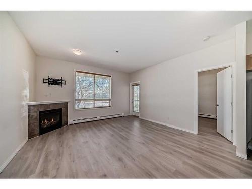 110-1000 Applevillage Court Se, Calgary, AB - Indoor With Fireplace