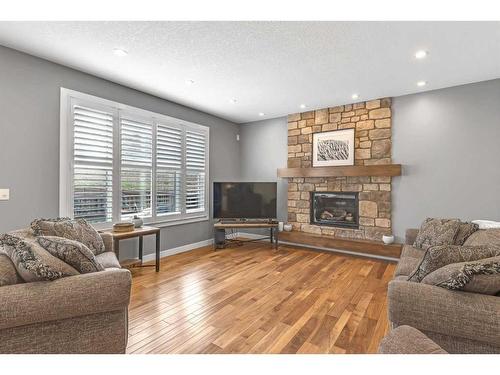 91 Cranbrook Crescent Se, Calgary, AB - Indoor Photo Showing Living Room With Fireplace