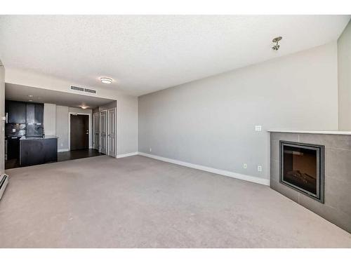 1907-99 Spruce Place Sw, Calgary, AB - Indoor With Fireplace