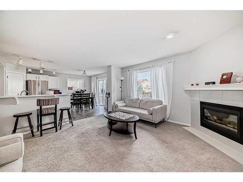 83 Somercrest Grove Sw, Calgary, AB - Indoor Photo Showing Living Room With Fireplace