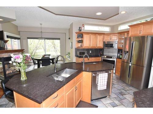 10 Mt Gibraltar Heights Se, Calgary, AB - Indoor Photo Showing Kitchen With Double Sink
