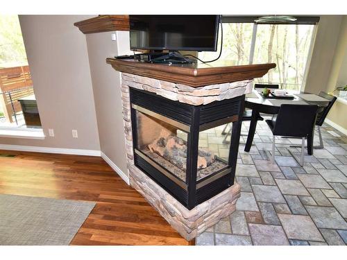 10 Mt Gibraltar Heights Se, Calgary, AB - Indoor With Fireplace