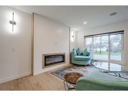 4620 30 Avenue Sw, Calgary, AB - Indoor Photo Showing Living Room With Fireplace