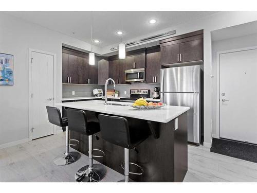 110-6603 New Brighton Avenue Se, Calgary, AB - Indoor Photo Showing Kitchen With Upgraded Kitchen