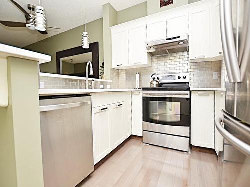 107-1408 17 Street Se, Calgary, AB - Indoor Photo Showing Kitchen With Stainless Steel Kitchen With Upgraded Kitchen