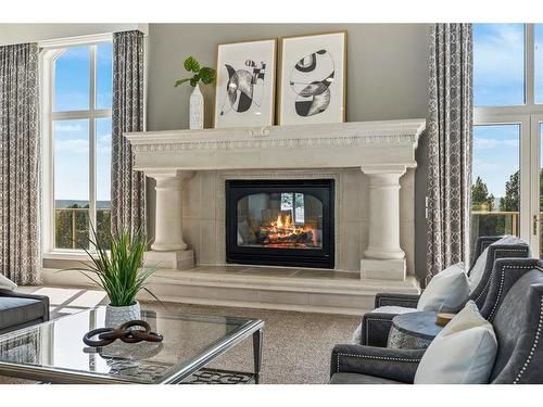 36 West Meadows Drive, Rural Rocky View County, AB - Indoor Photo Showing Living Room With Fireplace