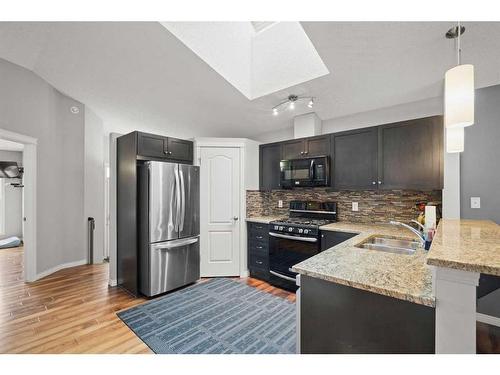 1363 New Brighton Park Se, Calgary, AB - Indoor Photo Showing Kitchen With Double Sink With Upgraded Kitchen
