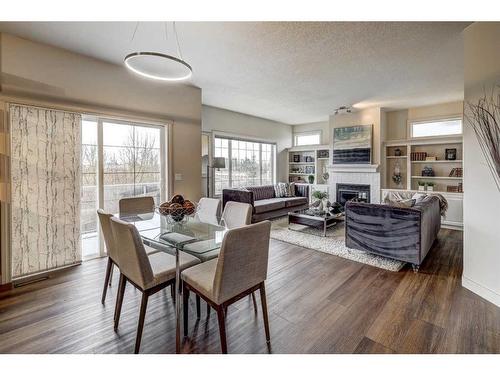 24 Royal Highland Court Nw, Calgary, AB - Indoor With Fireplace