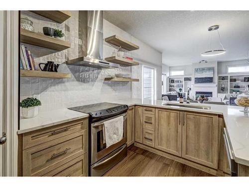 24 Royal Highland Court Nw, Calgary, AB - Indoor Photo Showing Kitchen With Upgraded Kitchen