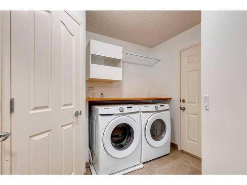 25 Cranston Drive Se, Calgary, AB - Indoor Photo Showing Laundry Room