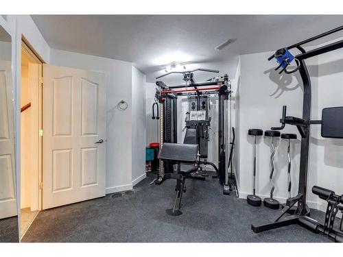 25 Cranston Drive Se, Calgary, AB - Indoor Photo Showing Gym Room