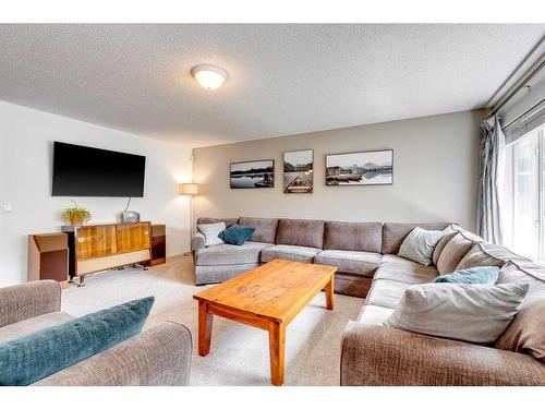 25 Cranston Drive Se, Calgary, AB - Indoor Photo Showing Living Room