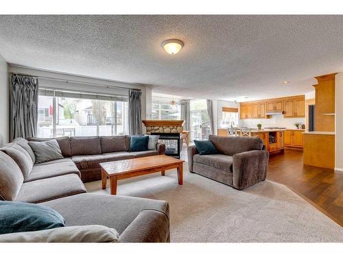 25 Cranston Drive Se, Calgary, AB - Indoor Photo Showing Living Room With Fireplace