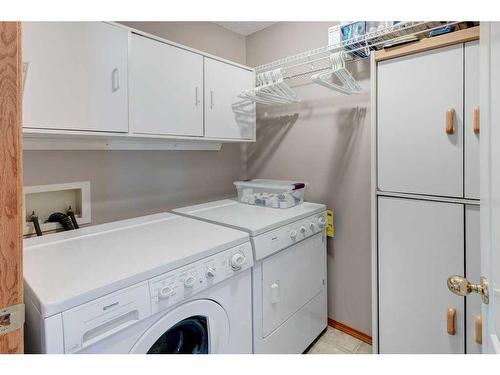135 Hidden Circle Nw, Calgary, AB - Indoor Photo Showing Laundry Room