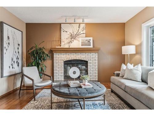 111 Sandringham Close Nw, Calgary, AB - Indoor Photo Showing Living Room With Fireplace