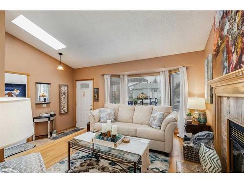 208 Cedargrove Court Sw, Calgary, AB - Indoor Photo Showing Living Room With Fireplace