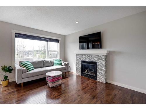 38 Nolanfield Road Nw, Calgary, AB - Indoor Photo Showing Living Room With Fireplace