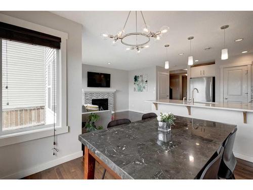 38 Nolanfield Road Nw, Calgary, AB - Indoor Photo Showing Dining Room With Fireplace